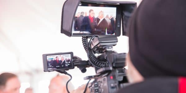 Behind the scenes of a camera filming Kevin Orrock of Summerlin