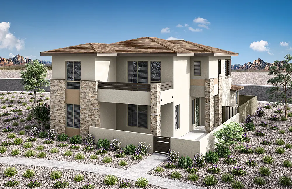 Modern two-story house with stone and beige stucco exterior, flat brown roof, and multiple windows. The yard is landscaped with gravel, small shrubs, and a few trees, set in a desert environment under a blue sky.